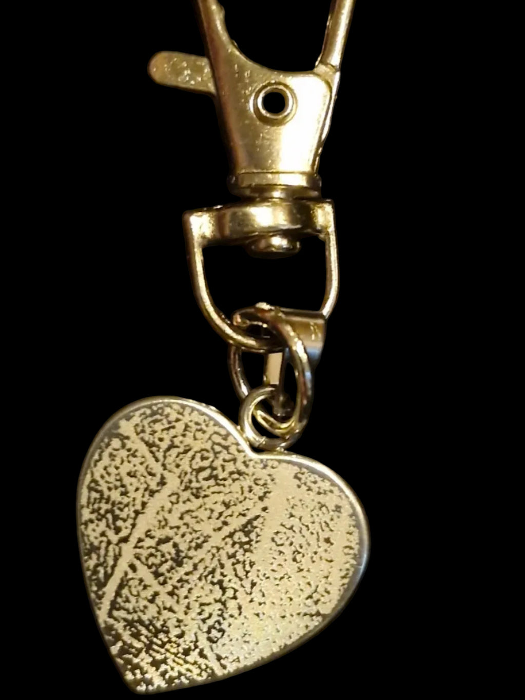 Stainless Steel Heart with an engraved fingerprint. Both side can be engraved. 